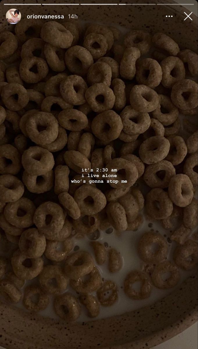 a bowl full of cereal sitting on top of a table