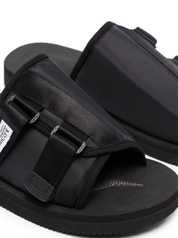 Why not slip into something a little more stylish? With a logo patch detail and a slip-on style - this pair of KAW-Cab slides from Suicoke tick every box. And they even come in one, how handy. Featuring an open toe, a front logo patch, a slip-on style, an open back and a ridged rubber sole. | Suicoke KAW-Cab slip-on slides Pool Slides, Flip Flop Sandals, Patch Logo, Open Back, Open Toe, Rubber Sole, Slides, Slip On, Buckle