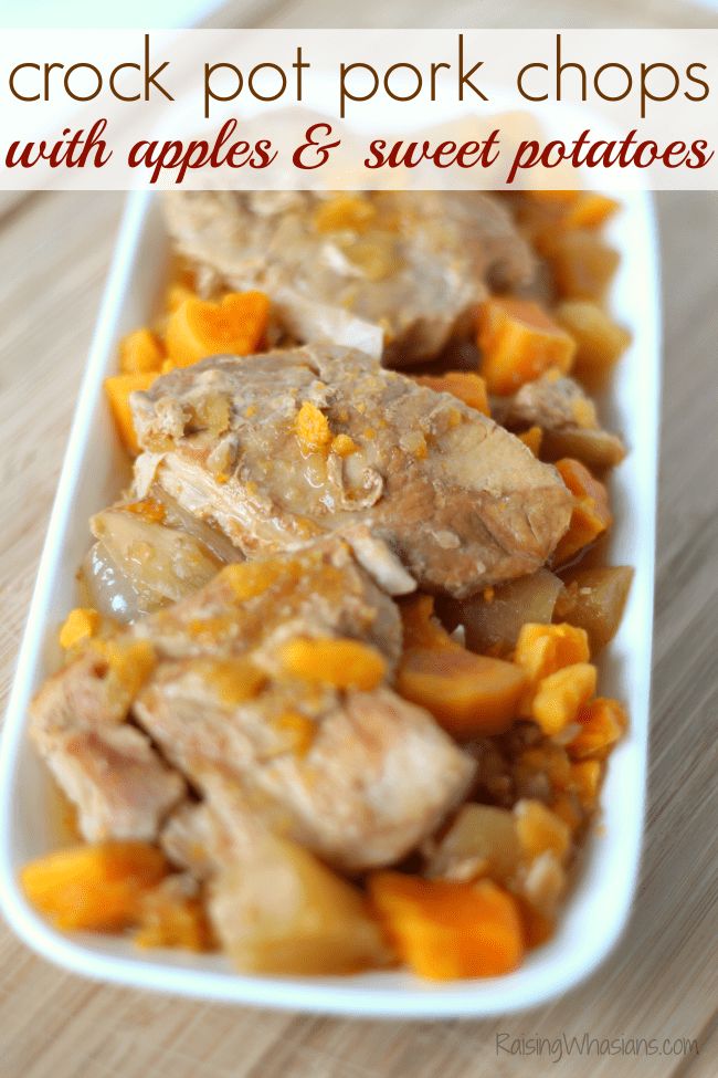 crock pot pork chops with apples and sweet potatoes in a white serving dish