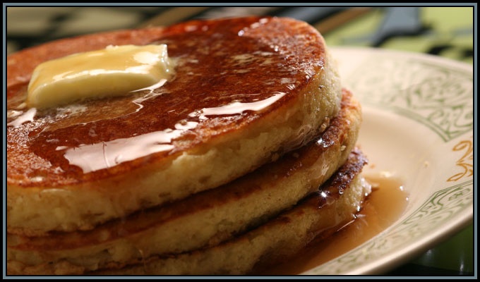 pancakes with butter and syrup on a plate