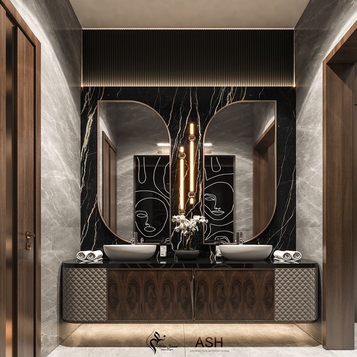 an elegant bathroom with two sinks and mirrors