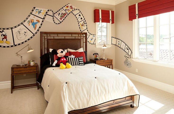 a bedroom decorated in mickey mouse theme