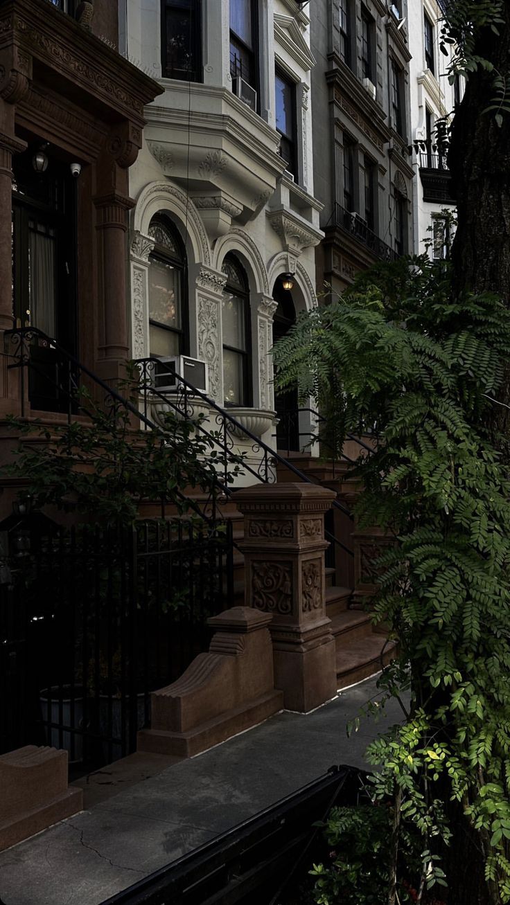 an apartment building with many windows and stairs