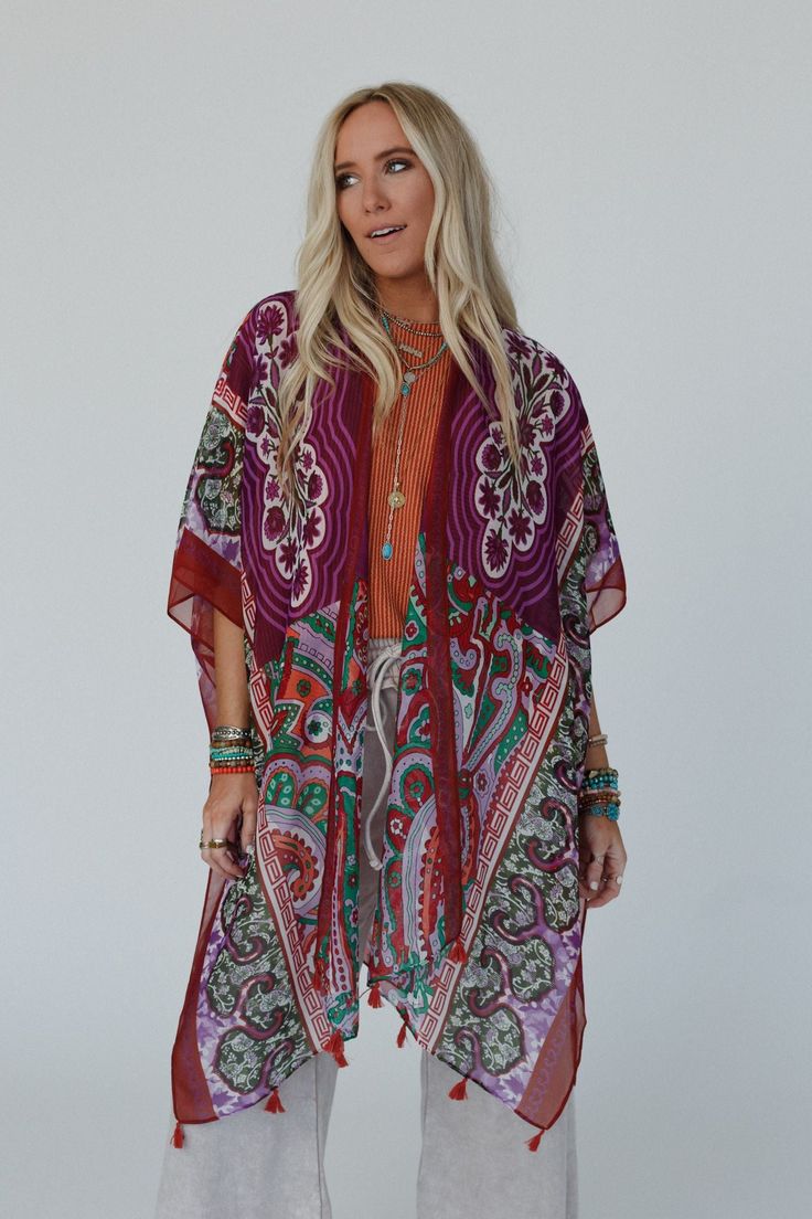 You'll add a stunning addition to your boho wardrobe with our Tabitha Floral Kimono, sure to become a cherished piece in your collection, adding a touch of bohemian glamour to every occasion! You'll love layering with this eye-catching kimono becasue it features: Lightweight, woven, slightly sheer fabric with a so pretty print throughout Relaxed and loose kimono silhouette Classic open front closure Loose kimono style sleeves and side slits created by single side seams So cute tassel details alo Bohemian Kimono With Boho Print For Beach Cover-up, Red One-size Kimono For Festivals, Festive Bohemian Kaftan With Floral Print, Multicolor Boho Print Hippie Kimono, Bohemian Printed Kimono For Beach Cover-up, Hippie Multicolor Boho Print Kimono, Bohemian Festive Kaftan, Multicolor Free Size Boho Print Kimono, Multicolor Boho Print Free Size Kimono