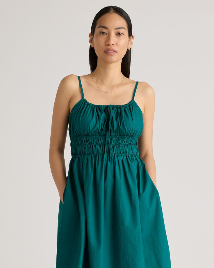 Discover the effortless charm of our 100% Organic Cotton Keyhole Midi Dress. Crafted with care from premium organic cotton poplin, this must-have dress has a cool, crisp look and a lightweight feel. The smocked bodice hugs your ribs in a flattering yet comfortable way, while the front tie and adjustable straps allow you to customize the fit. Best part: it has pockets! Easy to dress up or down, this chic silhouette works for a range of occasions.  | Quince | Women's Keyhole Midi Dress in Garden G Relaxed Cotton Dress For Garden Party, Relaxed Fit Cotton Dress For Garden Party, Green Cotton Mini Dress For Brunch, Casual Cotton Midi Dress With Smocked Back, Casual Cotton Dress With Smocked Back, Spring Cotton Sundress For Daywear, Summer Cotton Dress With Smocked Back, Cotton Sundress With Smocked Back For Brunch, Spring Cotton Midi Dress With Smocked Back