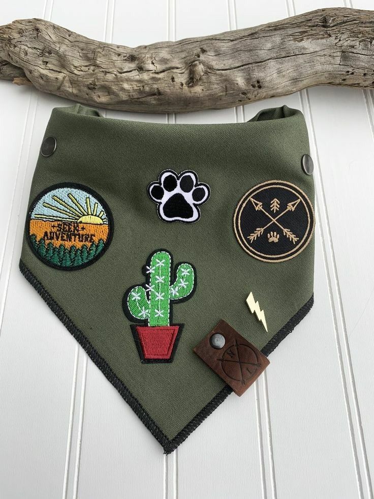 a green bandana with patches on it