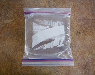 the ziploc bag is sitting on the floor