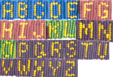 the words are written in different colors and sizes, including letters that appear to be made out of beads