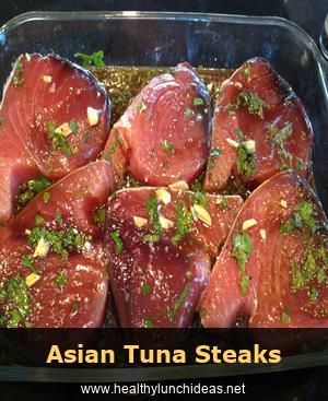 raw tuna fillets in a glass dish ready to be cooked