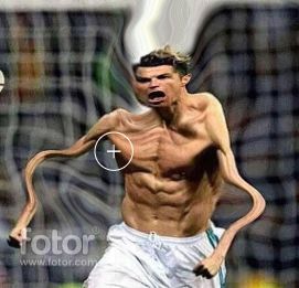 a man running with a soccer ball in his hand and an alien like face on his chest