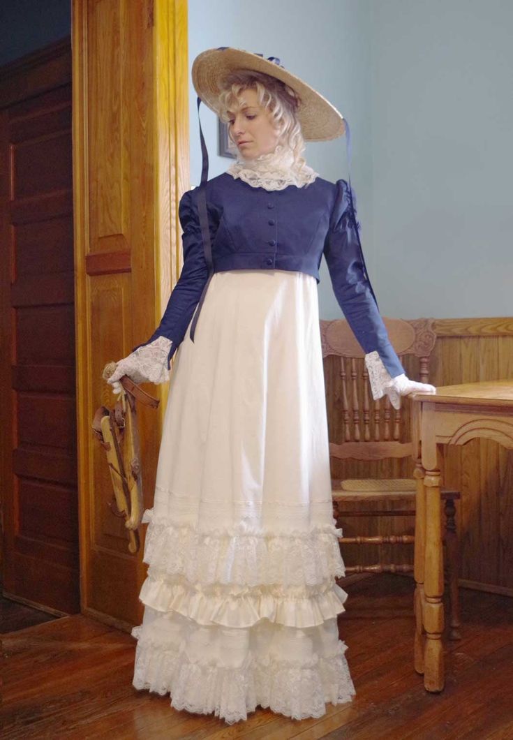 This Regency ensemble consists of these 3 pieces: dress, jacket, and lace collar. Early 1800s romantic styled ivory cotton gown with high waist. Historic look with short puffed sleeves gathered to cotton bands. The long cotton skirt is attached to the fitted bodice and has alternating ruffles and lace at the hemline. Back zipper closure. The separate short Spencer jacket in twill has long sleeves with flared split cuffs revealing the ruffled lace. The ruffled lace collar completes the Regency lo Long Cotton Skirt, Spencer Jacket, Cotton Gowns, Burgundy Jacket, Regency Dress, Clothes Vintage, Twill Jacket, Corduroy Dress, Prairie Dress