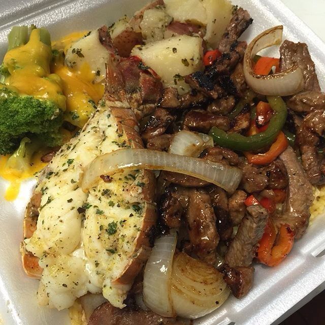 a plastic container filled with meat and veggies on top of mashed potatoes