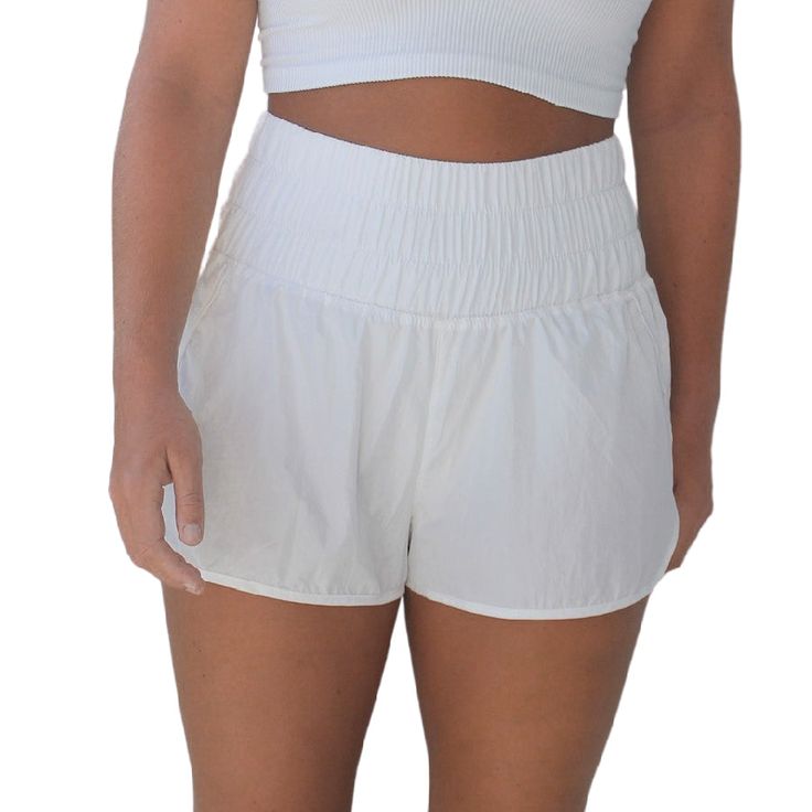 these free people running shorts are light and breezy. they feature a surprisingly comfortable high-rise smocked waistband that can easily be folded down and a side split hem for added style. also available in green mist, artic mist, deep sea, varsity gold, army, and black. details 100% nylon machine wash cold size + fit model is 5'7 wearing a size small Free People Running, People Running, Workout Attire, White C, The Way Home, Side Split, Split Hem, Running Shorts, Outfit Sets