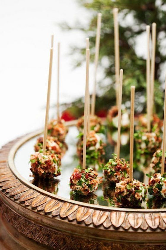 there are many food items on the plate and one is made out of cake pops