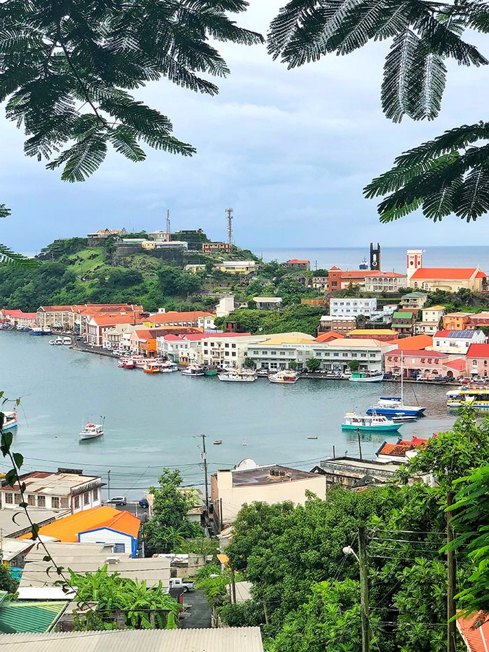 an aerial view of a harbor with boats in the water and buildings on both sides