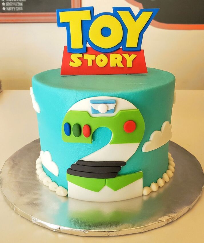 a toy story themed birthday cake on a table