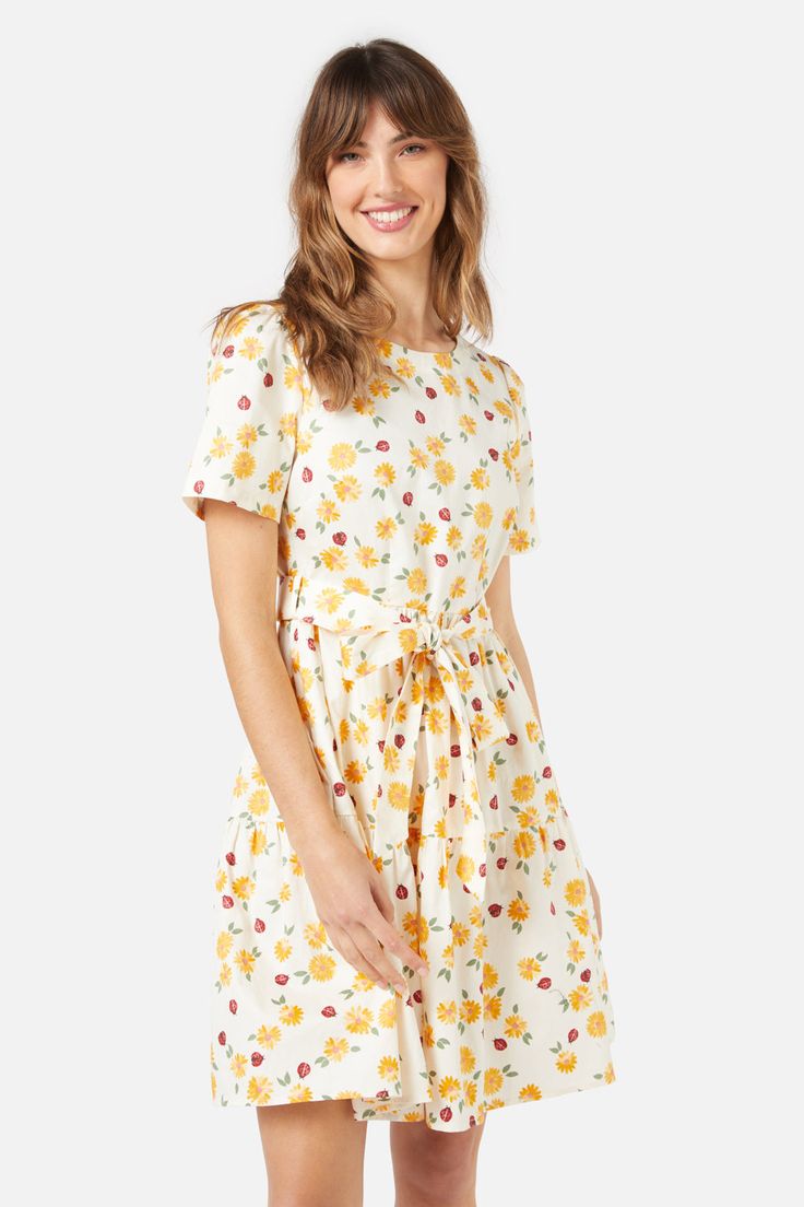 Ladybird printed mini dress with short sleeves and a detachable waist tie. Featuring daisy florals, this vintage inspired style is so cute for picnics- fitted bodice with short sleeves- two tiered gathered skirt- length reaches just above the knee- style with or without the matching sash- hidden back zipper- made of a soft cotton twill fabric- available in cream Product Code: PGFY046 Dress With Short Sleeves, Gathered Skirt, Dress 16, Twill Fabric, Cotton Twill Fabric, Printed Mini Dress, Fitted Bodice, Above The Knee, Waist Tie