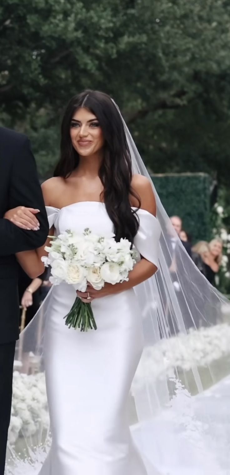 the bride and groom are walking down the aisle