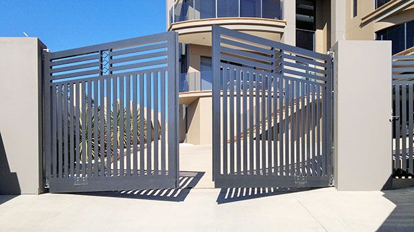 an image of a modern gate in front of a building