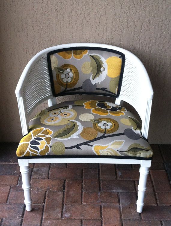 a white chair with an owl pattern on it