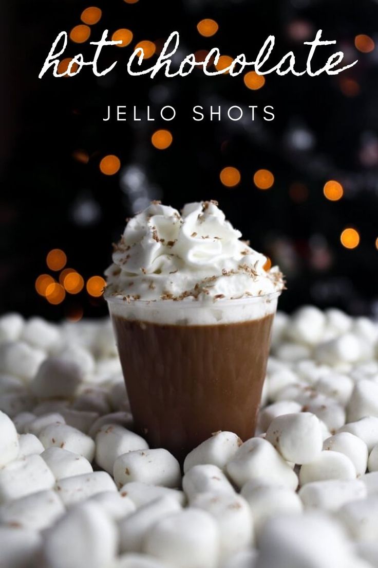 hot chocolate jello shots with white marshmallows on top and the words hot chocolate jello shots above it