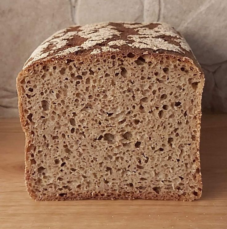 a loaf of bread sitting on top of a wooden table