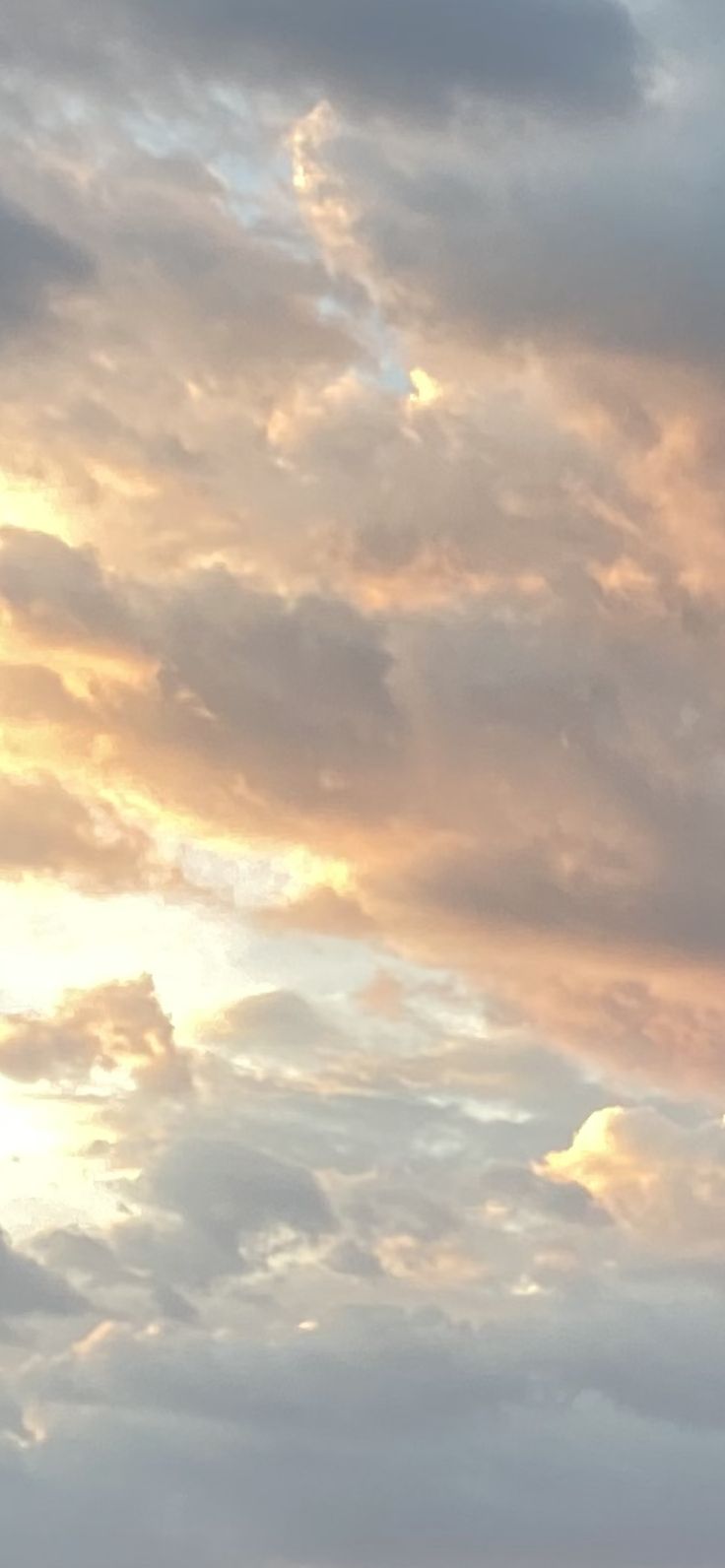 two airplanes flying in the sky at sunset