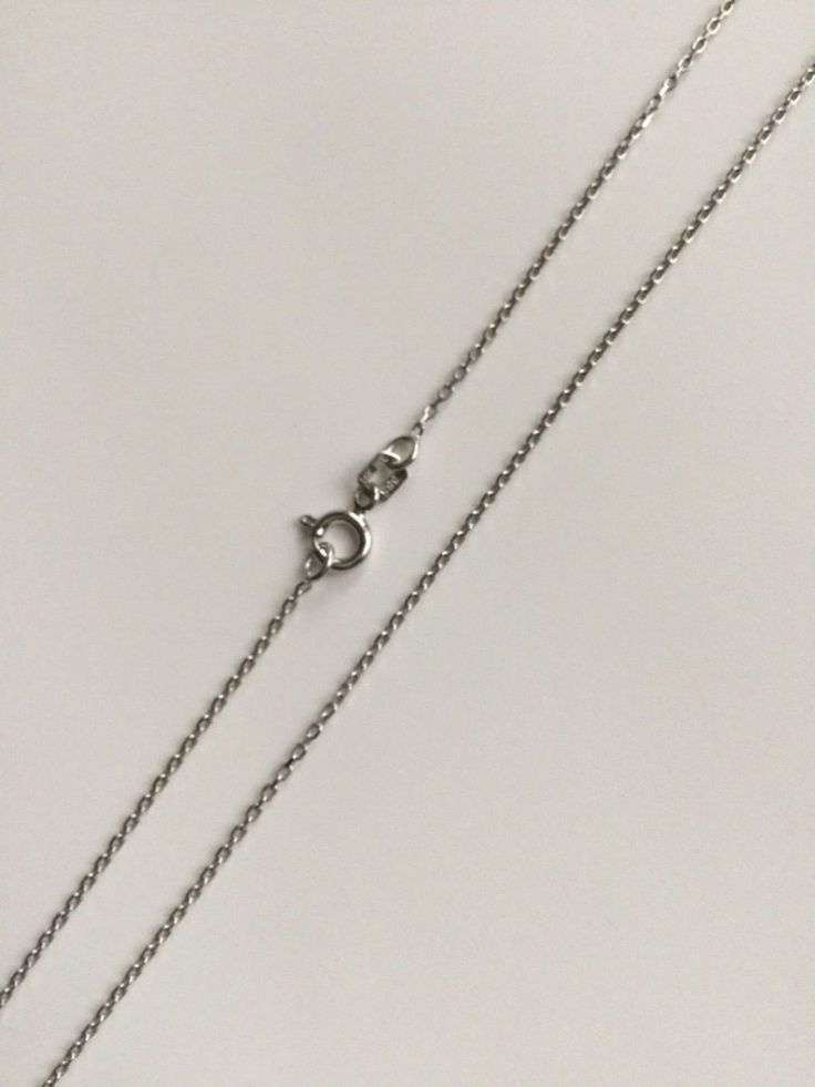 "14K SOLID WHITE GOLD INFINITY NECKLACE .REAL 14K GOLD (NOT PLATED OR FILLED) 18\" LONG .-- 2.4 GR -. FOR EMPOWERMENT,EVERLASTING LOVE AND ETERNITY. PENDANT SIZE : 20 mm X 8 mm ---MADE IN ITALY-BEST QUALITY--- FREE GIFT BOX NOTE:THIS ITEM IS SHIPPED WITH SIGNATURE CONFIRMATION. CADENA DE INFINITO EN ORO PURO 14K . 18\" LARGO.-- 2.4 GR-- PARA AMOR ,BUENA SUERTE. DIJE: 20 mm X 8 mm ---MEJOR CALIDAD-HECHO EN ITALIA--- CAJA DE REGALO GRATIS NOTA:ESTE ARTICULO SERA ENVIADO CON CONFIRMACION DE LA FIRM Silver Cable Chain Jewelry For Anniversary, Silver Cubic Zirconia Necklace With Cable Chain, Classic Sterling Silver Infinity Necklace, Infinity Cable Chain Jewelry Gift, Diamond Cable Chain Necklace Gift, Diamond Cable Chain Necklace As Gift, Silver Cable Chain Jewelry With Cubic Zirconia, White Gold Infinity Necklace With Cubic Zirconia, Minimalist Infinity Necklace In White Gold