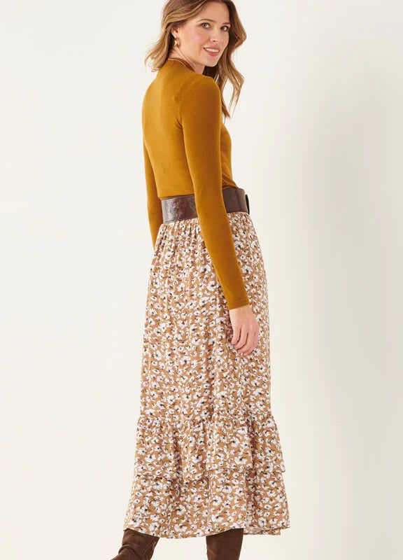 Add some country charm to your fall wardrobe with an easy fit and flowy maxi skirt. Long petticoat tiers style up this darling fall floral with comfy elastic waist silhouette. 100% Viscose Fall Tiered Ruffled Skirt, Casual Brown Maxi Skirt For Fall, Modest Fall Skirt With Elastic Waistband, Casual Tiered Maxi Skirt With Floral Print, Floral Print Tiered Skirt For Fall, Fall Floral Print Tiered Skirt, Tiered Floral Print Skirt For Fall, Brown Tiered Skirt Bottoms For Fall, Fall Floral Print Flowy Maxi Skirt