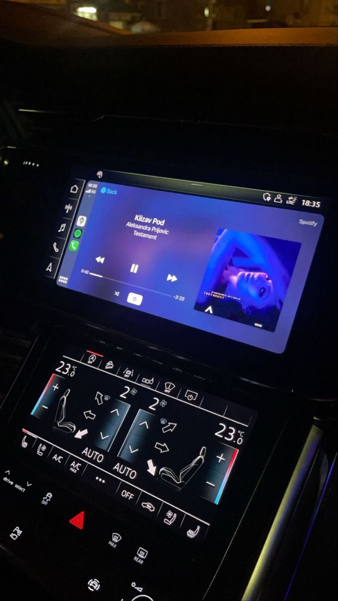 the dashboard of a car with an electronic device on it