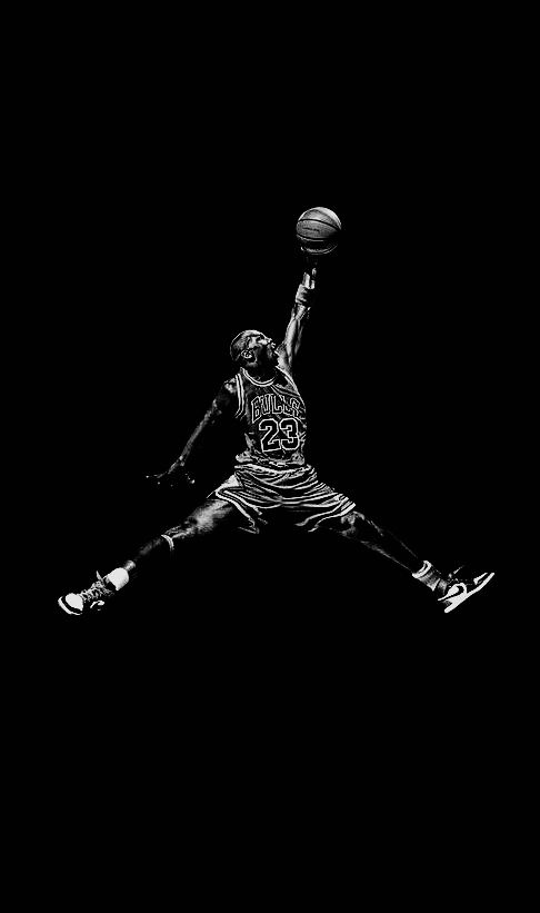 a basketball player is jumping up to dunk the ball in black and white photo