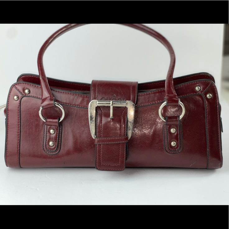 Gucci Vintage Handbag With Some Damages To The Exterior That Are All In The Pictures. It’s A Beautiful Burgundy Color, The Zipper Works Perfectly And So Does The Front Buckle. -Ships Within 48 Hours -Reasonable Offers Accepted -Bundle Offers Accepted Gucci Satchel With Top Handle And Branded Hardware, Gucci Shoulder Satchel, Gucci Satchel With Detachable Strap And Double Handle, Gucci Satchel With Branded Hardware, Gucci Shoulder Bag Satchel For Shopping, Gucci Satchel With Detachable Strap, Gucci Shoulder Bag With Detachable Strap And Double Handle, Gucci Leather Shoulder Bag For Daily Use, Classic Gucci Shoulder Bag For Shopping