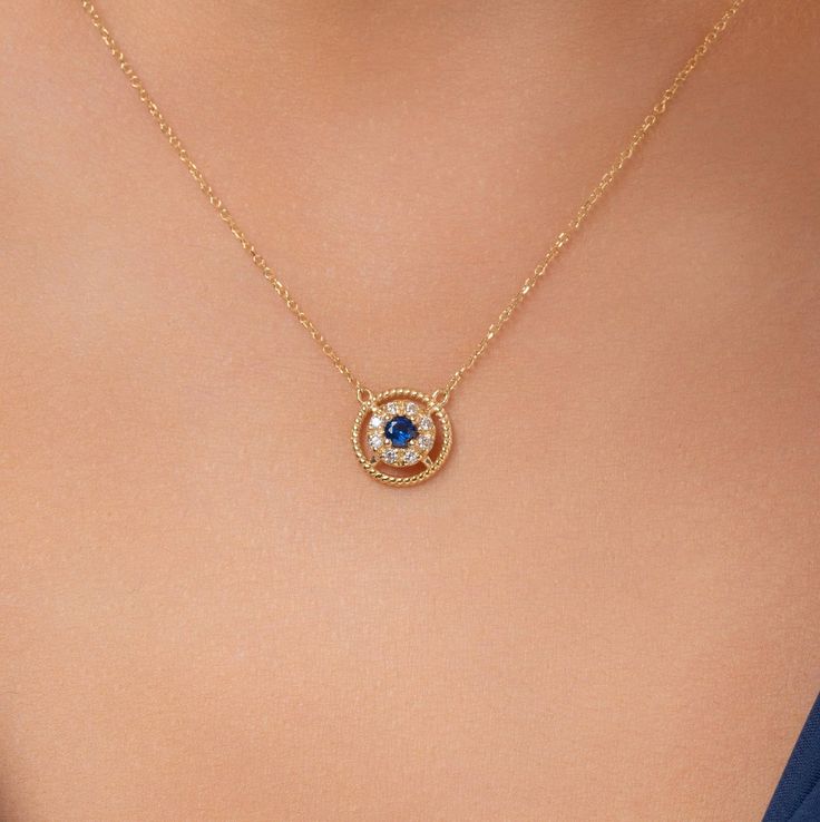 The 14k Solid Gold Evil Eye Necklace--an elegant and mystical piece that should be added to your jewelry collection. This beautiful necklace comes with an evil eye pendant, delicately designed for protection against negativity. Complementing the detailed pendant is a 14k gold chain, lustrous in design for durability and beauty throughout time. Wear it single or layered with other pieces of jewelry for any occasion to complete your look and add a touch of allure and sophistication. Embrace the bl Formal Round Birthstone Necklace With Delicate Chain, Gold Round Necklace With Jewels, Elegant Gold Birthstone Necklace With 17 Jewels, Elegant Sapphire Jewel Necklace, Fine Jewelry Birthstone Necklace For Formal Occasions, Fine Jewelry Blue Necklace For Anniversary, Fine Jewelry Necklace With Round Pendant, Blue Necklaces For Anniversary In Fine Jewelry Style, Blue Clavicle Chain Necklace For Wedding