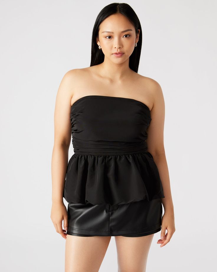 Elevate your style with our AMARI top. This top features a strapless design and bubble-hem taffeta design, it is both chic and comfortable. Perfect for any occasion, it will add a touch of sophistication to your wardrobe. Strapless bubble-hem peplum top Taffeta design Elastic on top Length: 17.75" 100% polyester Hand wash Joy is 5ft 9in and is wearing a size medium Amelia is 5ft 10.5in and is wearing a size small Fit tip: If you are in between sizes, size down Imported Chic Ruched Tube Top For Party, Chic Peplum Top For Date Night, Chic Peplum Top For Night Out, Chic Fitted Ruched Peplum Top, Chic Ruched Tube Top For Date Night, Chic Strapless Ruched Top, Bandeau Top For Party With Ruched Detail, Ruched Bandeau Top For Party, Bandeau Ruched Top For Party