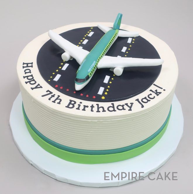 a birthday cake with an airplane on it