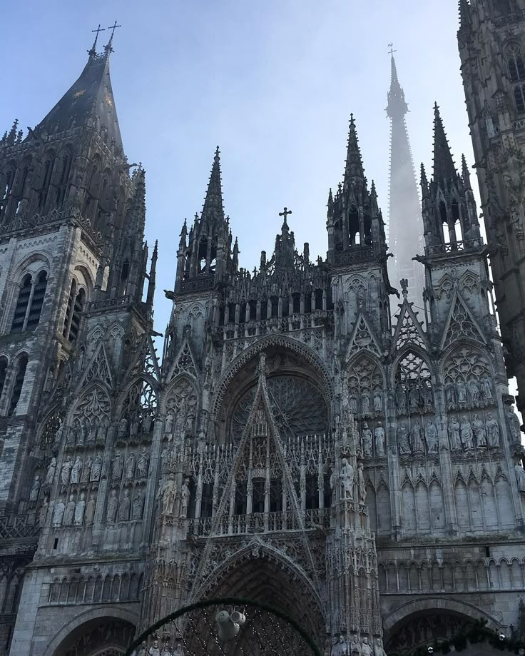 an old cathedral with spires and clock tower