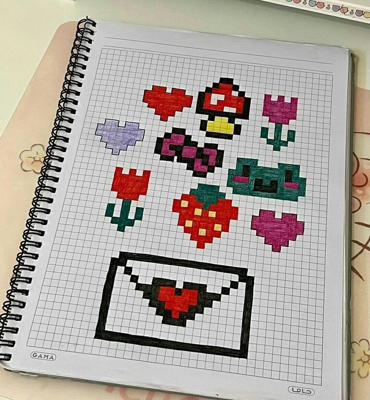 a notebook with some pixel art on it