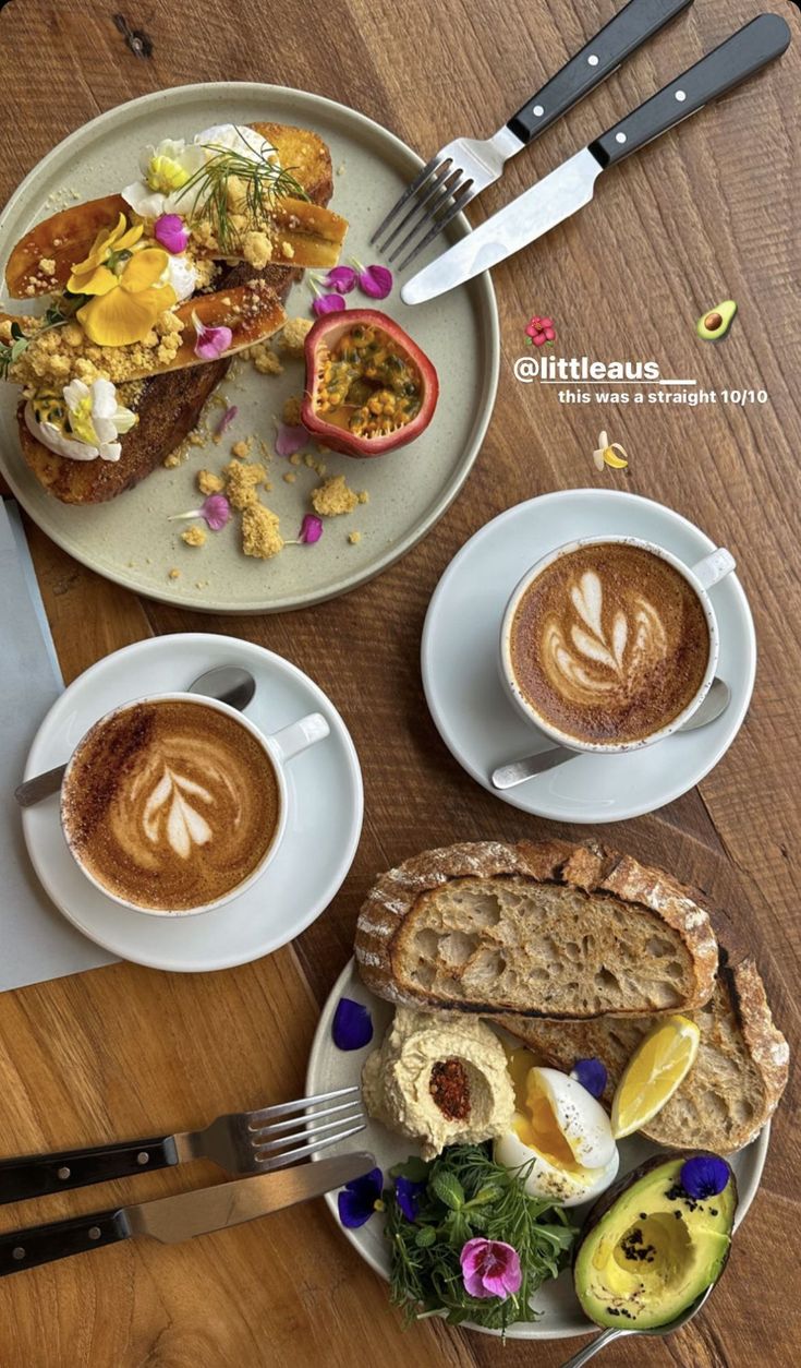 there are two plates with food on them and one has a cup of coffee in front of it