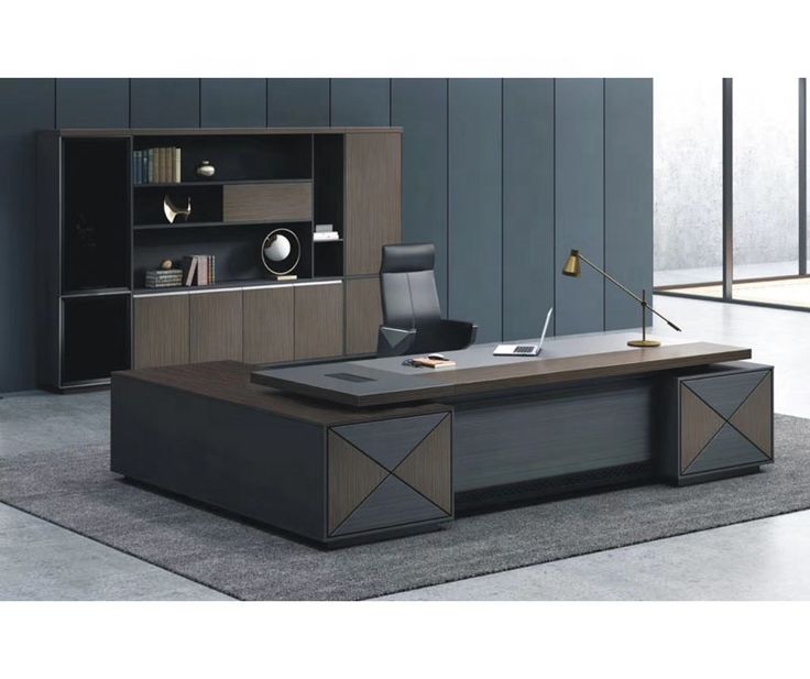 an office desk with black and brown furniture