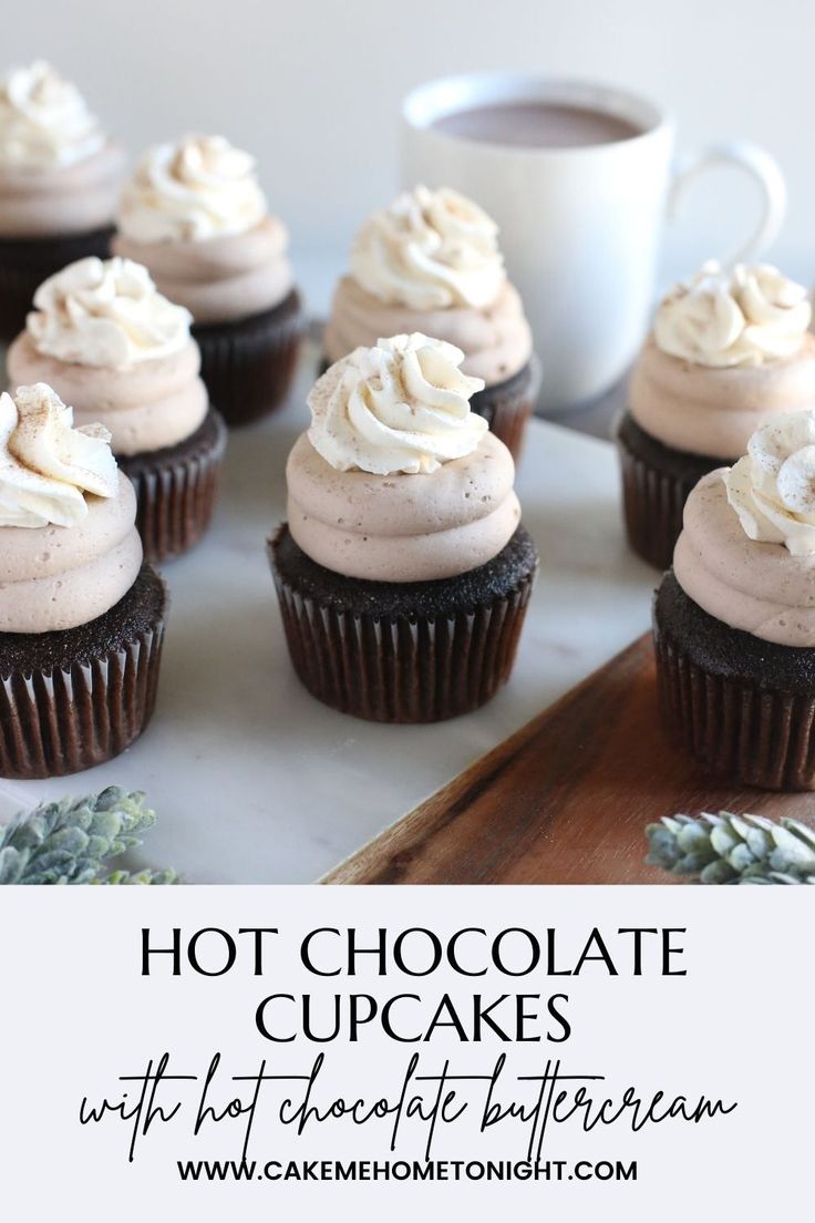 chocolate cupcakes with white frosting and sprinkles on a tray