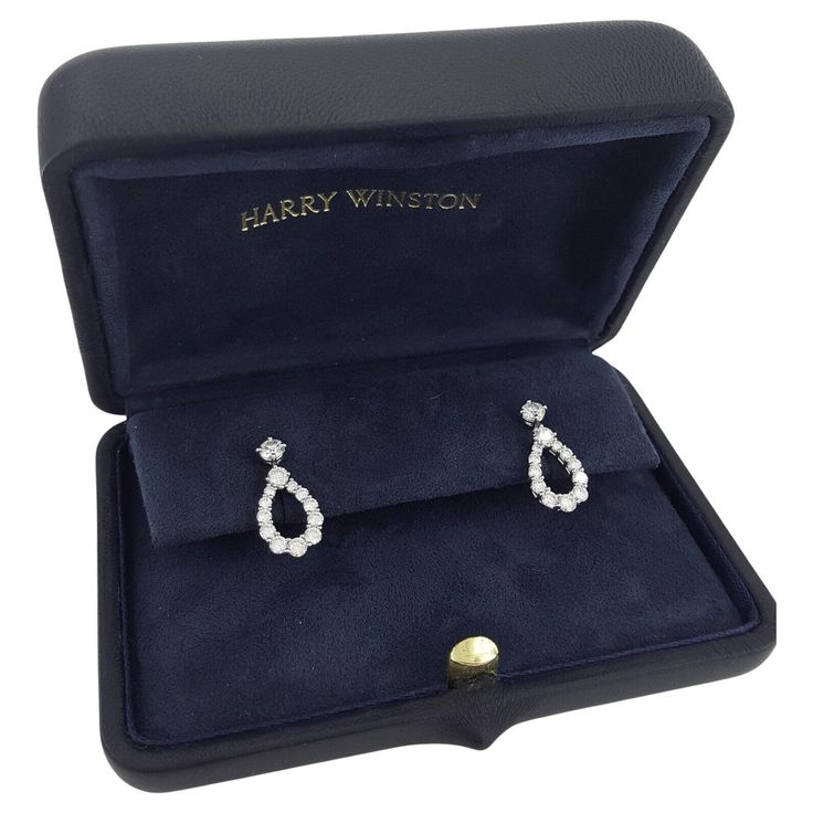 Presenting the epitome of luxury and sophistication: the Harry Winston Diamond Loop Diamond Earrings in medium size, crafted from platinum and exuding timeless elegance. Weighing 4.3 grams and measuring 20 x 9.3 mm (LxW), these exquisite earrings feature a dazzling array of 26 natural round brilliant cut diamonds, totaling approximately 1.55 carats. With a color range of E-G and clarity ranging from VVS to VS, each diamond radiates unparalleled brilliance and clarity. Adorned with the prestigious HW PT950 signature and unique serial number "513***", these earrings are a testament to Harry Winston's unwavering commitment to excellence and quality craftsmanship. Indulge in the unparalleled beauty and prestige of Harry Winston with these Diamond Loop Diamond Earrings. Elevate any ensemble wit Diamond Earrings Harry Winston, Harry Winston Earrings, Harry Winston Diamond Earrings, Harry Winston Engagement Ring, Harry Winston Ring, Harry Winston Jewelry, Harry Winston Diamond, Earrings Luxury, Harry Winston