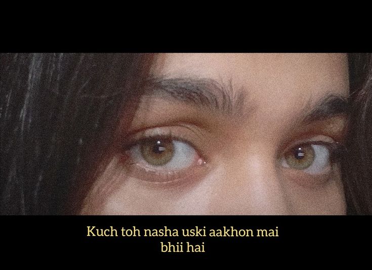 a close up of a person's face with the words kutch toh nassha akakton mai bihi hai