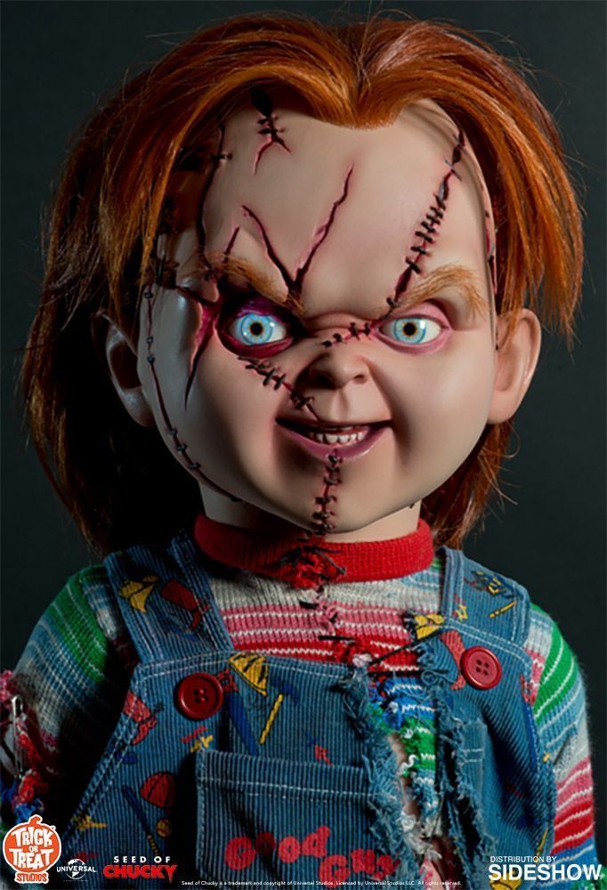 a doll with red hair and blue eyes is shown in the image, it looks like he