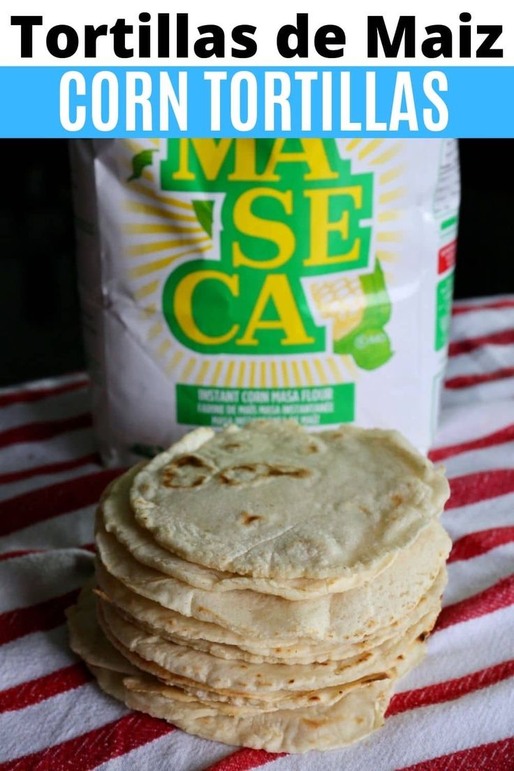 tortillas are stacked on top of each other in front of a bag of corn tortillas