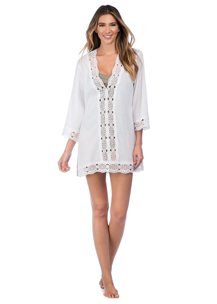 This lightweight cotton swimwear tunic by La Blanca features a crochet center panel in front to peep your swimsuit just beneath. Crochet trim along the neckline, cuffs and hem of this cover-up add a hint effortless elegance. [split] Details Swimwear cover up V neck tunic Crochet trim Long sleeves Fabric 100% Cotton (Crinkle voile) V-neck Beach Dress With Lace Trim, Chic Lace Trim Beach Cover-up, Beachwear Swimwear With Crochet Trim, Crochet Trim Swimwear For Beach, Fitted Beachwear Cover-up For Brunch, Beachwear V-neck Beach Dress With Lace Trim, Beachwear Swimwear With Crochet Trim For Vacation, Vacation Swimwear With Crochet Trim And Stretch, Beachwear Crochet Trim Swimwear For Vacation