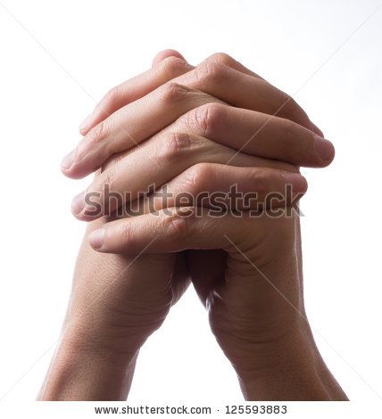 two hands clasped together in front of a white background with space for your text or image