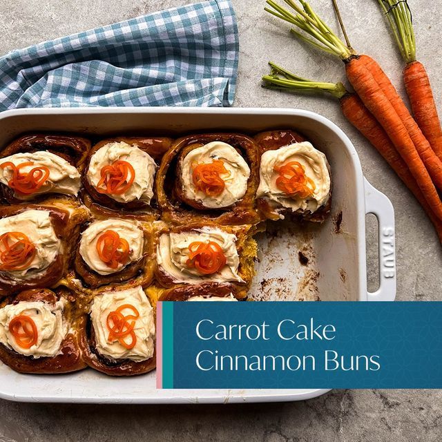 carrot cake cinnamon buns in a baking dish with the words carrot cake cinnamon buns