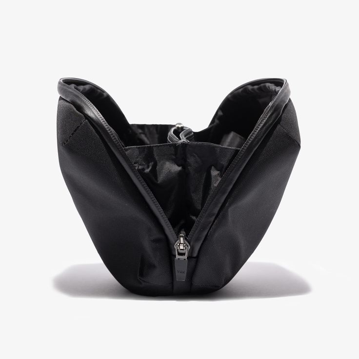 an open black purse on a white background