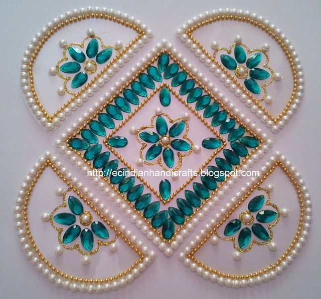 an intricately designed design with pearls and green glass beads on white background, suitable for wall hangings