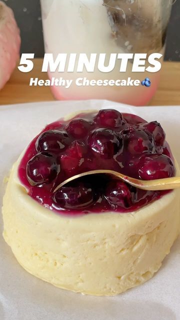 there is a small cake with cherries on it and the words 5 minutes healthy cheesecake